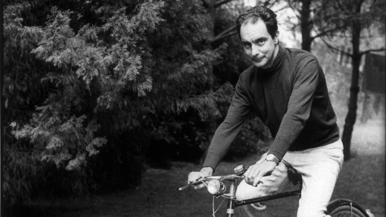 Italo Calvino on a bicycle; a period photograph, not Siena in 1985