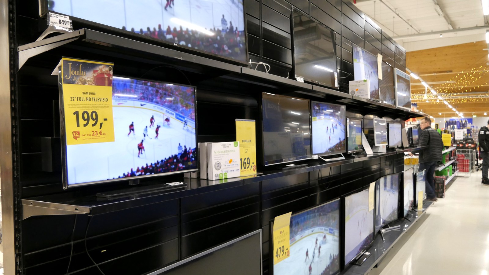 Televisions on sale in a store; a retail display, not the CTA announcement