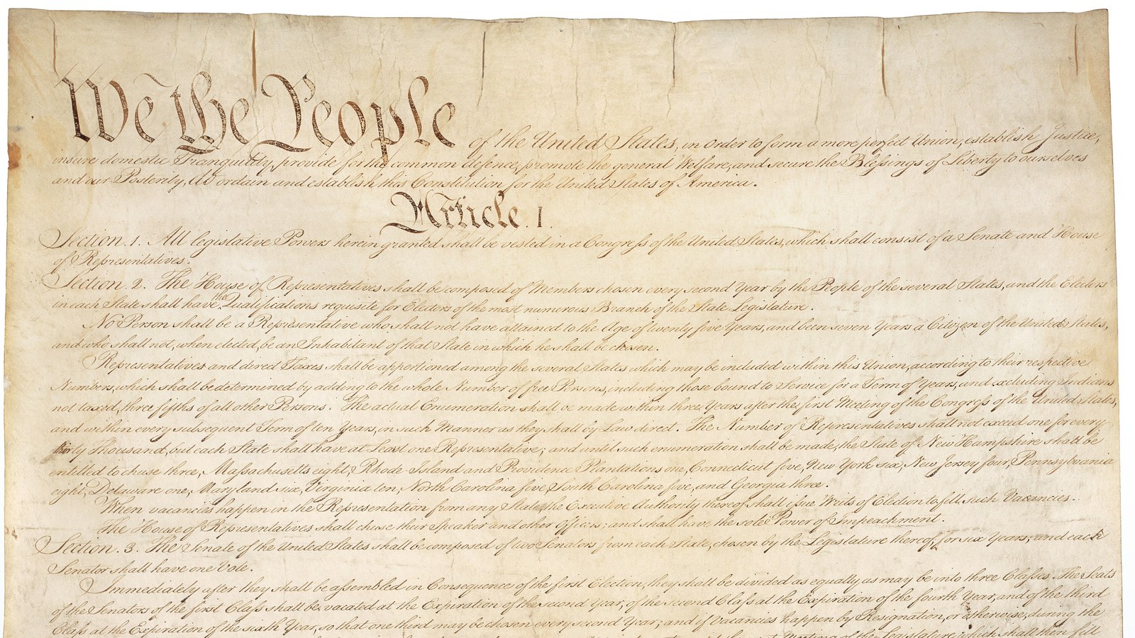 First page of the United States Constitution, parchment document held by the National Archives