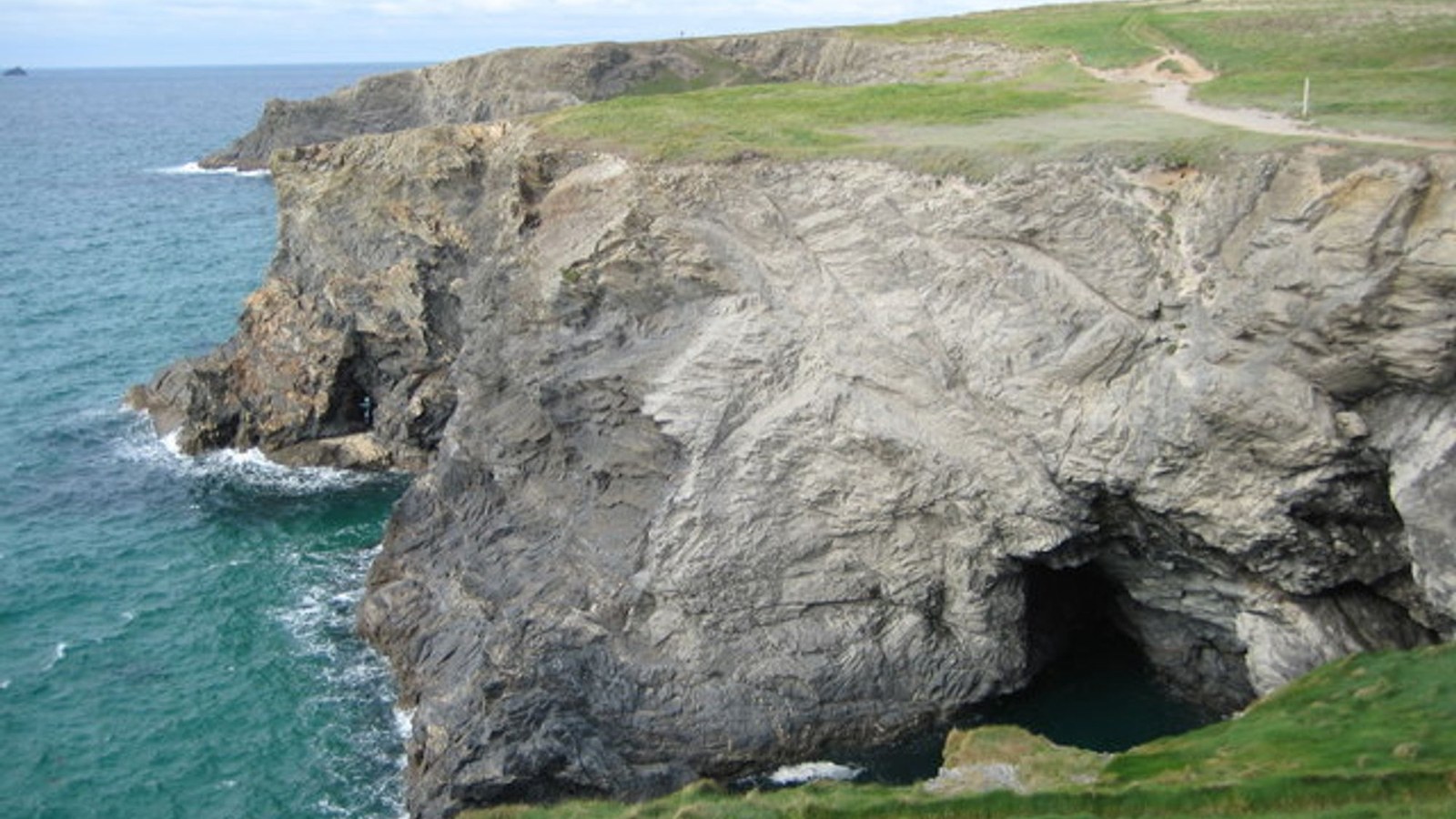 A rocky shore and ocean; not the mouth of a named river