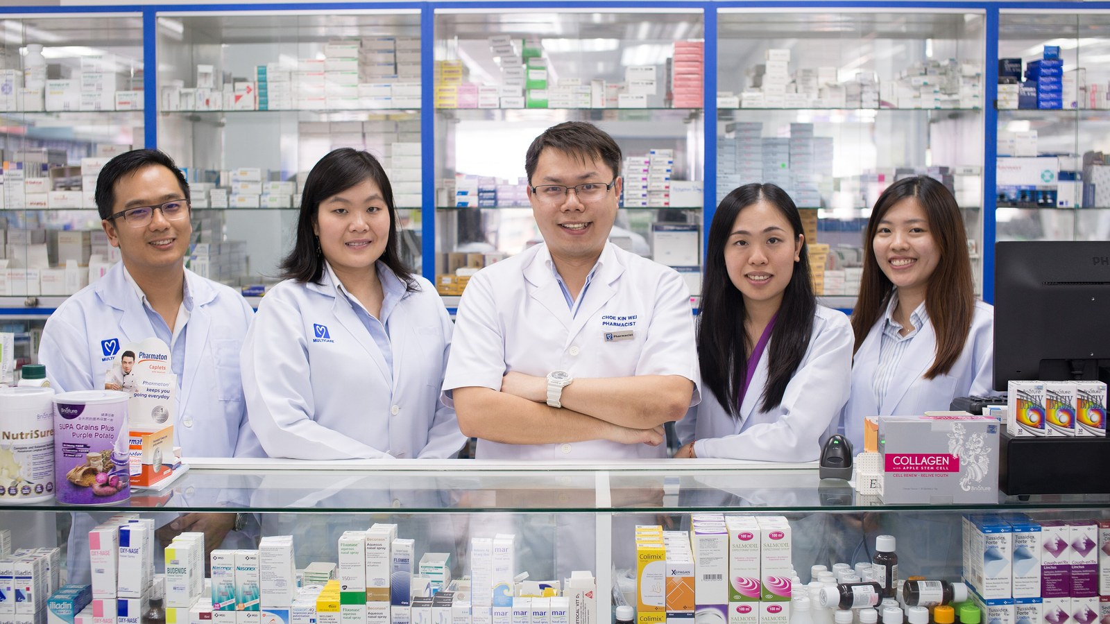 Pharmacists at a counter, 2016; not the 2026 FIP campaign