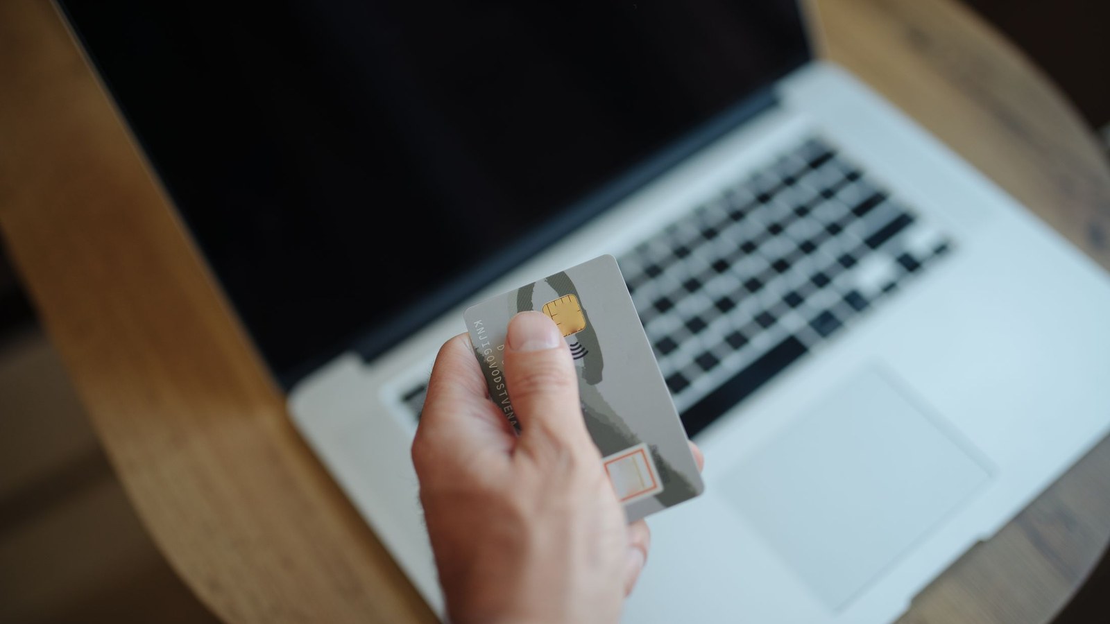 Person using a laptop; a finance illustration, not a public dashboard