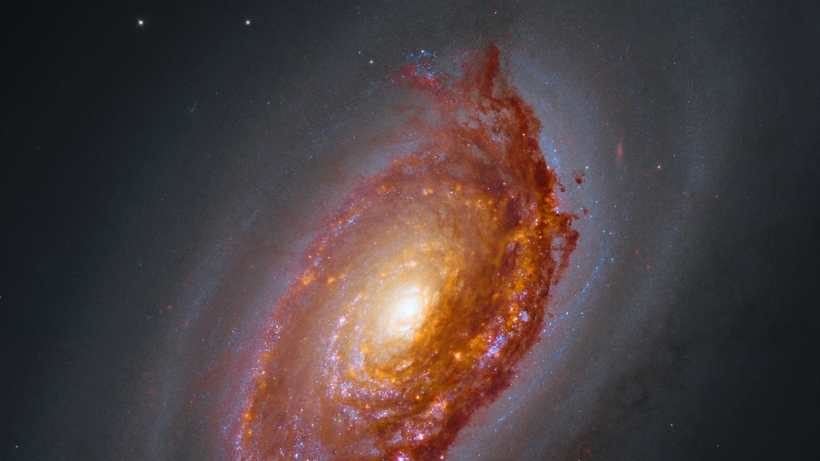 Galaxia Messier 64 observată de Hubble și James Webb